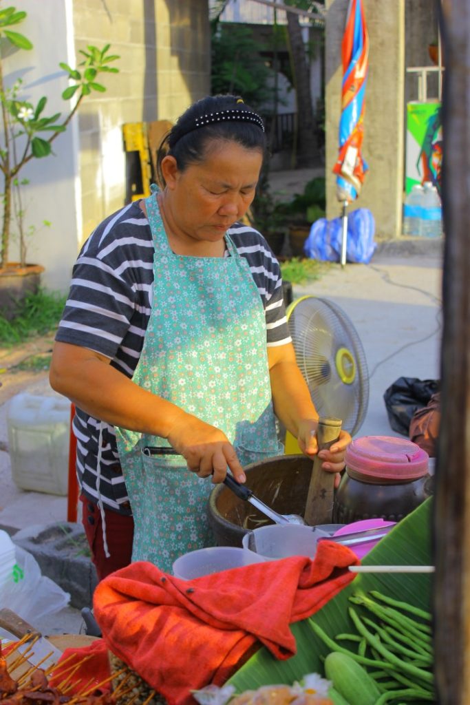 A lady making som tam bu at Fisherman's Village, Koh Samui.